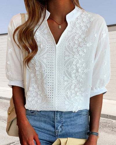 Blusa con scollatura a V e maniche a palloncino con decorazione in pizzo